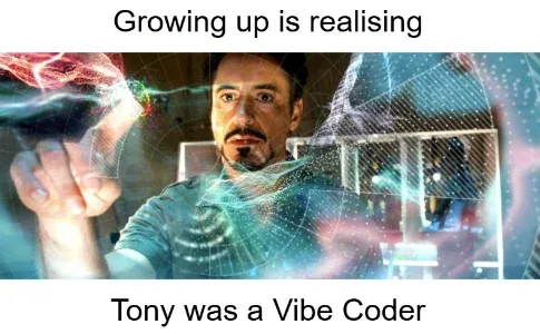 The meme that started it all — Tony Stark at his holographic workbench, hand outstretched into a schematic only he can see, captioned "Growing up is realising Tony was a Vibe Coder."